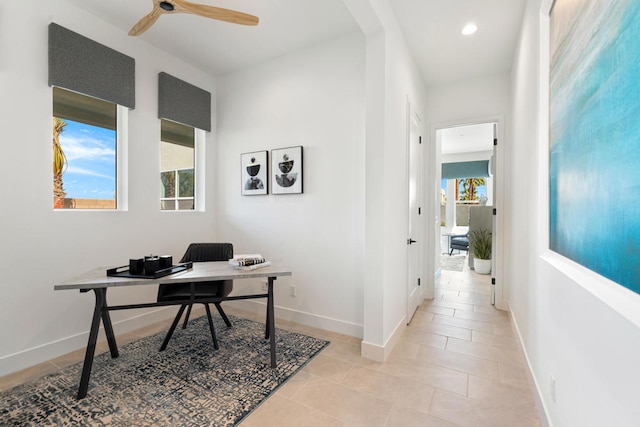 office area with ceiling fan, light tile patterned flooring, and a wealth of natural light