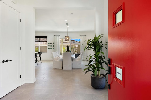 corridor featuring light tile patterned floors