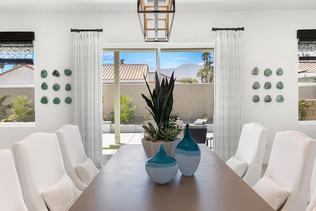 dining space with an inviting chandelier