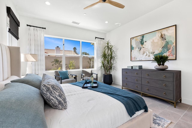 bedroom with light tile patterned floors and ceiling fan