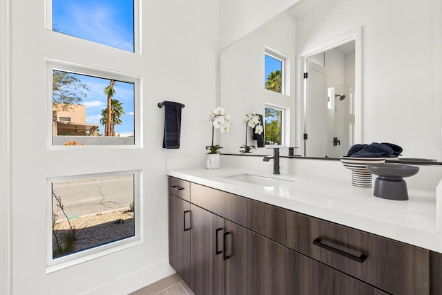 bathroom with vanity and tile patterned floors