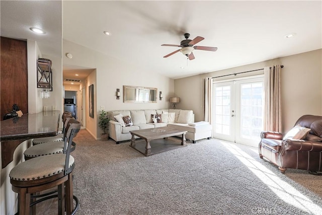 living room featuring ceiling fan, french doors, and carpet floors