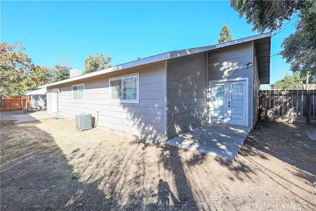 back of property with a patio and central air condition unit