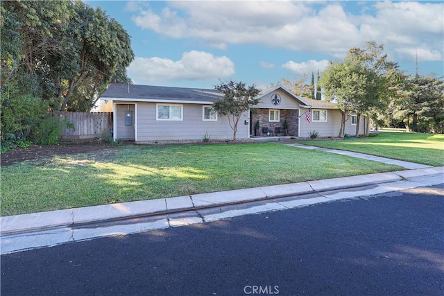 ranch-style home with a front yard