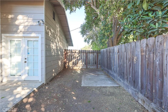 view of yard featuring french doors