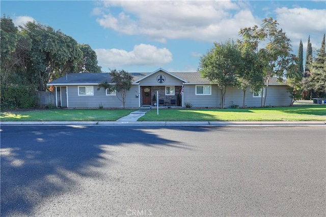 ranch-style house with a front lawn