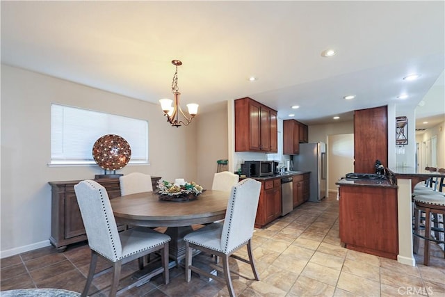 dining space with an inviting chandelier