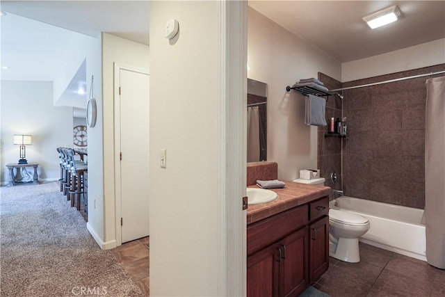 full bathroom with tile patterned flooring, vanity, toilet, and shower / bath combo with shower curtain