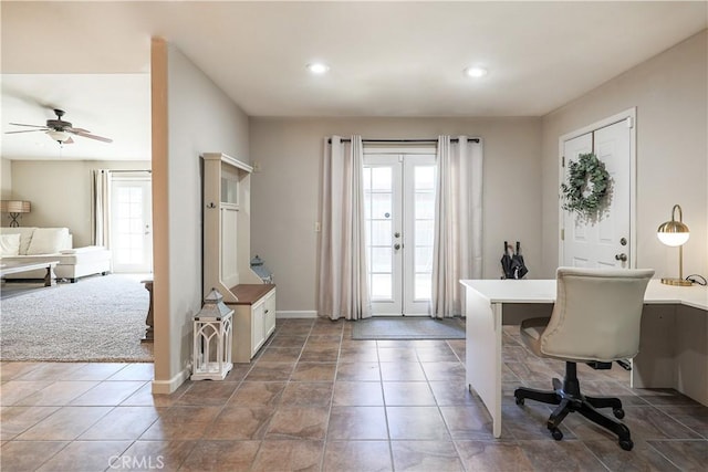 tiled home office featuring ceiling fan, plenty of natural light, and french doors