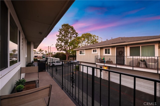 view of balcony at dusk