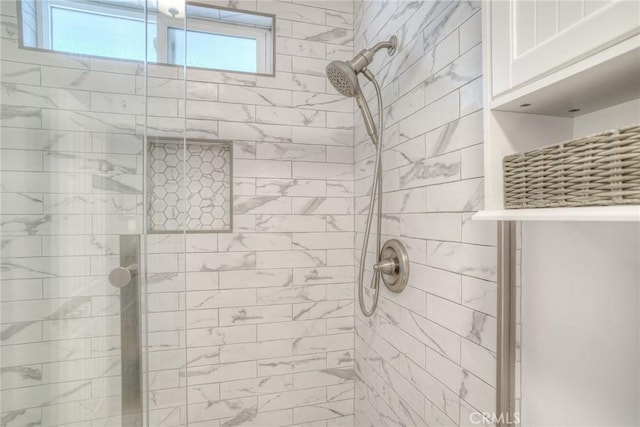 bathroom with a wealth of natural light and an enclosed shower