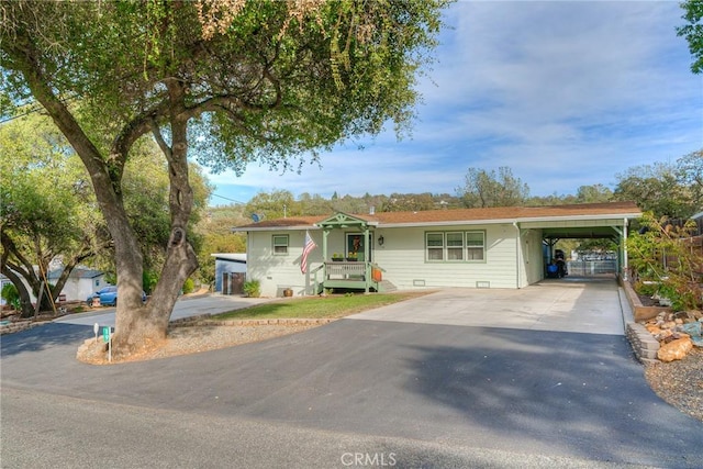 ranch-style home featuring a carport