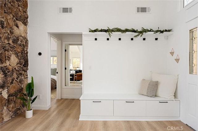 mudroom with light hardwood / wood-style floors