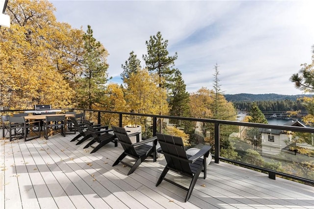 wooden terrace with a water view