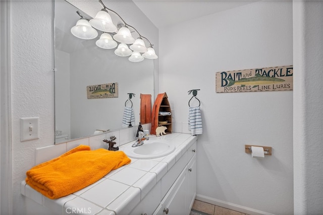 bathroom with vanity and tile patterned flooring