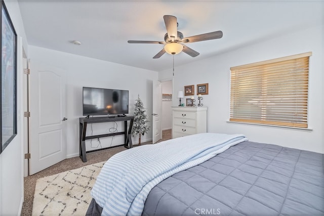 bedroom featuring light carpet and ceiling fan