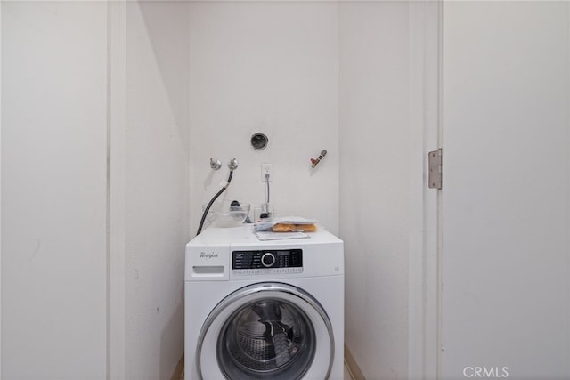 laundry area with washer / dryer