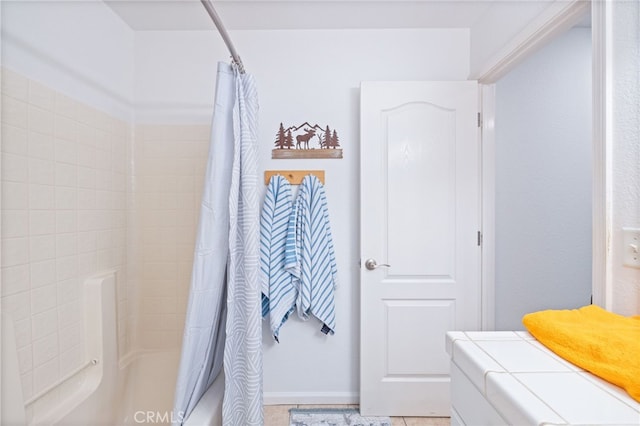 bathroom with shower / tub combo with curtain and tile patterned flooring