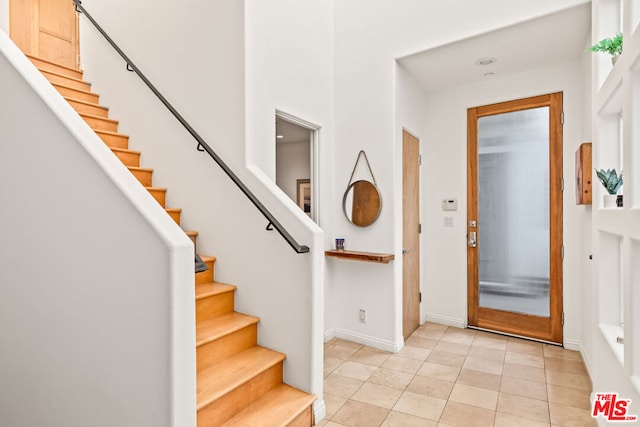 entrance foyer with light tile patterned flooring