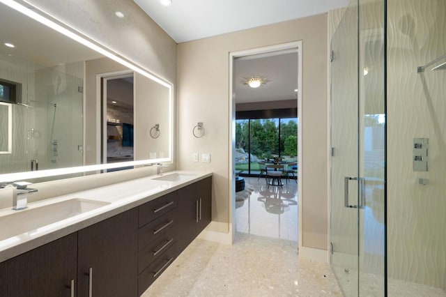 bathroom featuring vanity and a shower with shower door