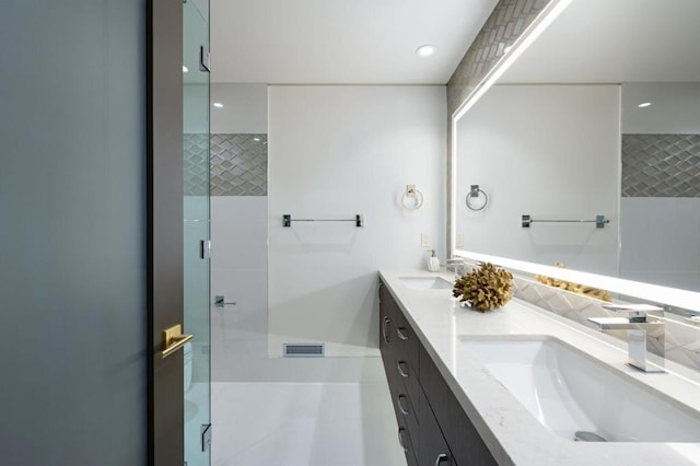 bathroom with vanity, tile patterned floors, and an enclosed shower