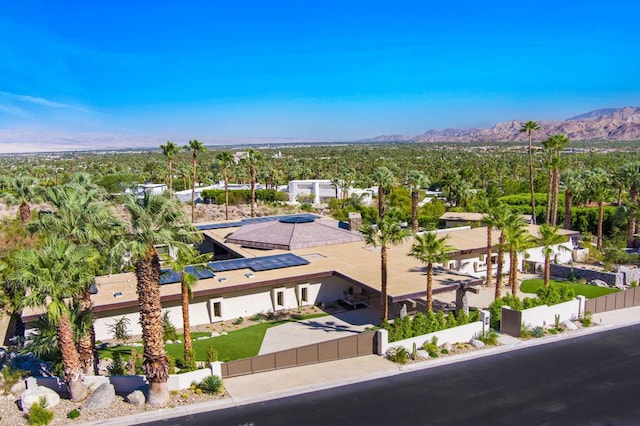 birds eye view of property with a mountain view