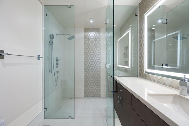 bathroom featuring vanity, tile patterned floors, and a shower with shower door