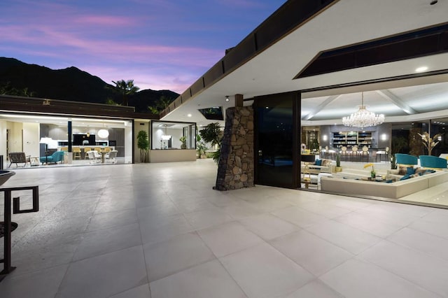 patio terrace at dusk with a mountain view