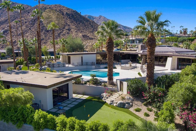 exterior space featuring a mountain view and a patio