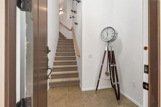 staircase featuring tile patterned floors