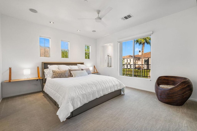 carpeted bedroom with ceiling fan