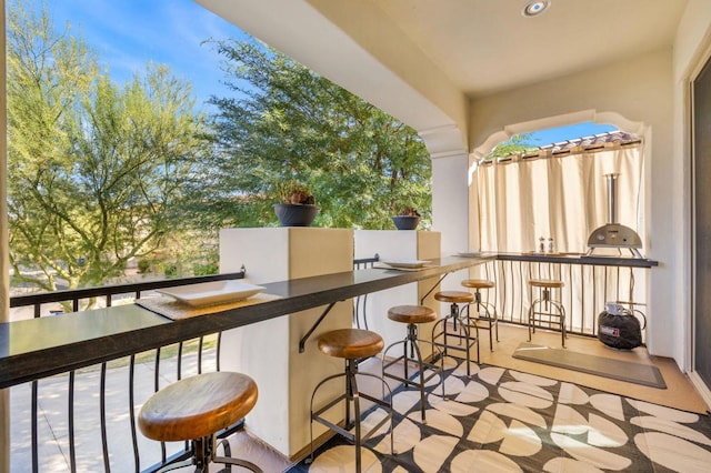 balcony featuring an outdoor bar