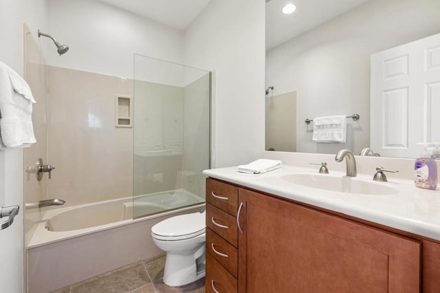 full bathroom with tile patterned flooring, toilet, combined bath / shower with glass door, and vanity