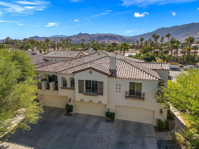 exterior space with a mountain view and a garage