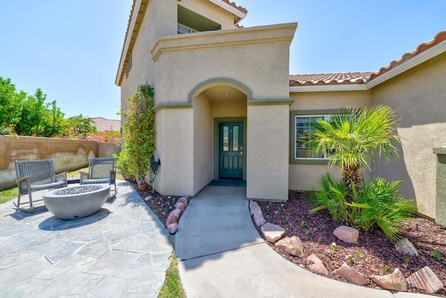 entrance to property featuring a patio