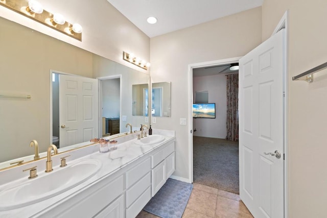 bathroom featuring ceiling fan, tile patterned flooring, vanity, and toilet