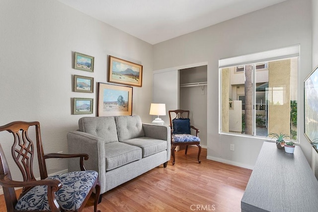 living area with hardwood / wood-style floors