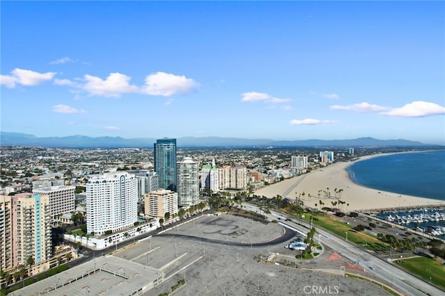 drone / aerial view featuring a water and mountain view