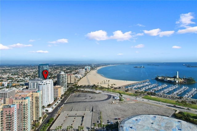 birds eye view of property with a view of the beach and a water view