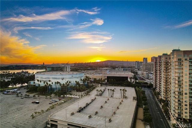 aerial view at dusk with a water view