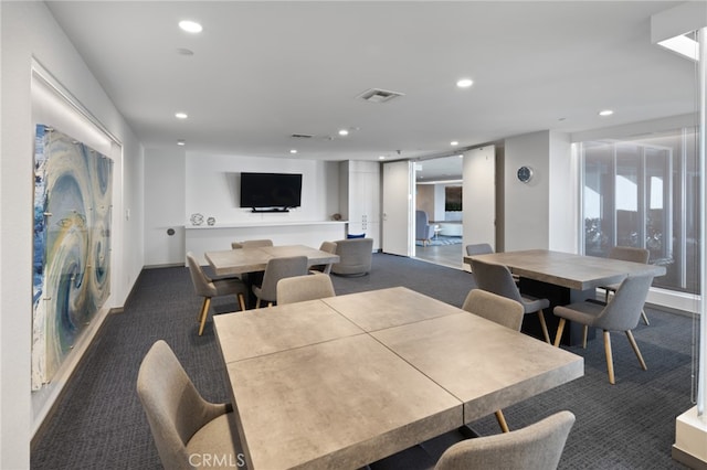 view of carpeted dining area