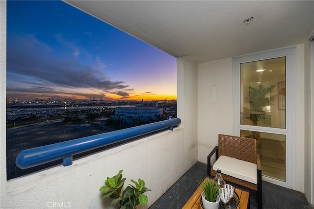 view of balcony at dusk