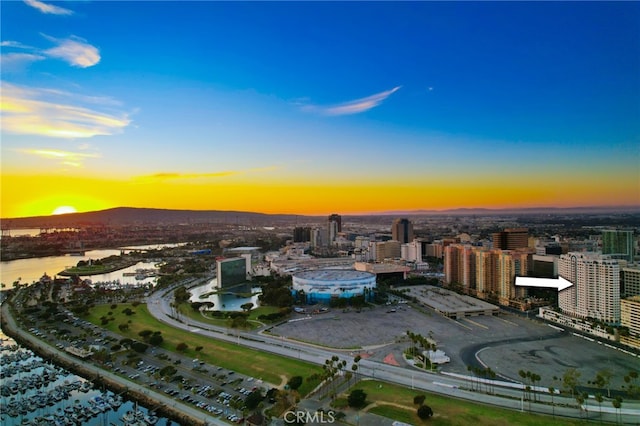 aerial view at dusk with a water view