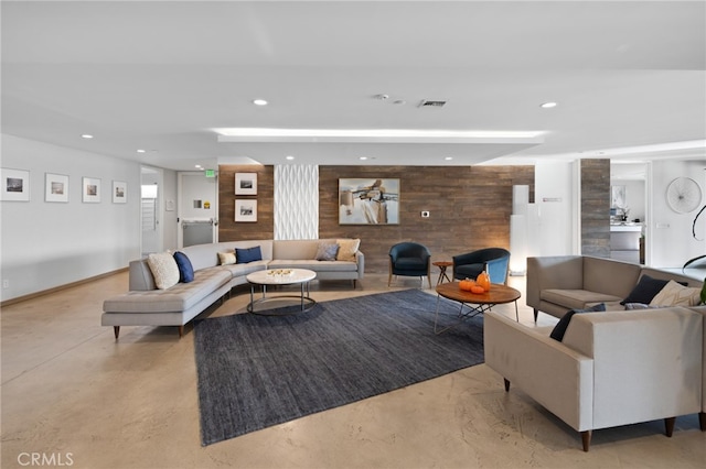 living room featuring wooden walls