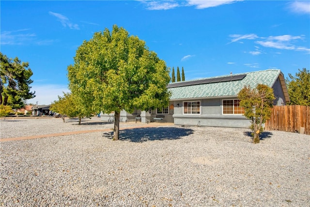 view of front of property with solar panels