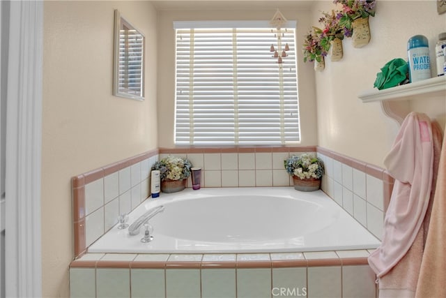 bathroom featuring tiled tub