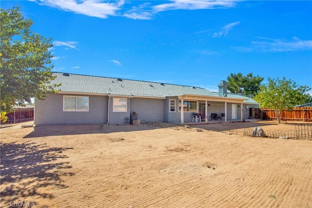 19848 Haida Rd, Apple Valley, CA 92307 - rear view of property with stucco siding, a tiled roof, a patio, and fence private yard