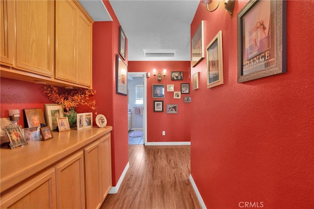 hallway featuring light hardwood / wood-style flooring