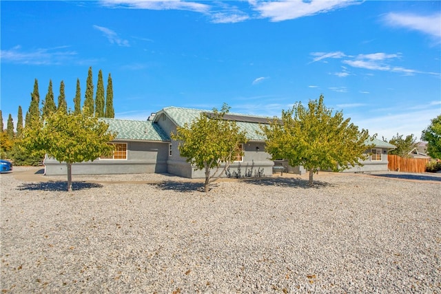 view of property hidden behind natural elements