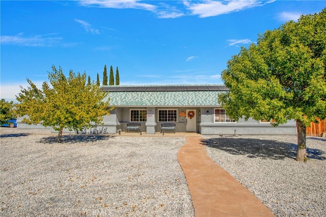 view of front of house with solar panels